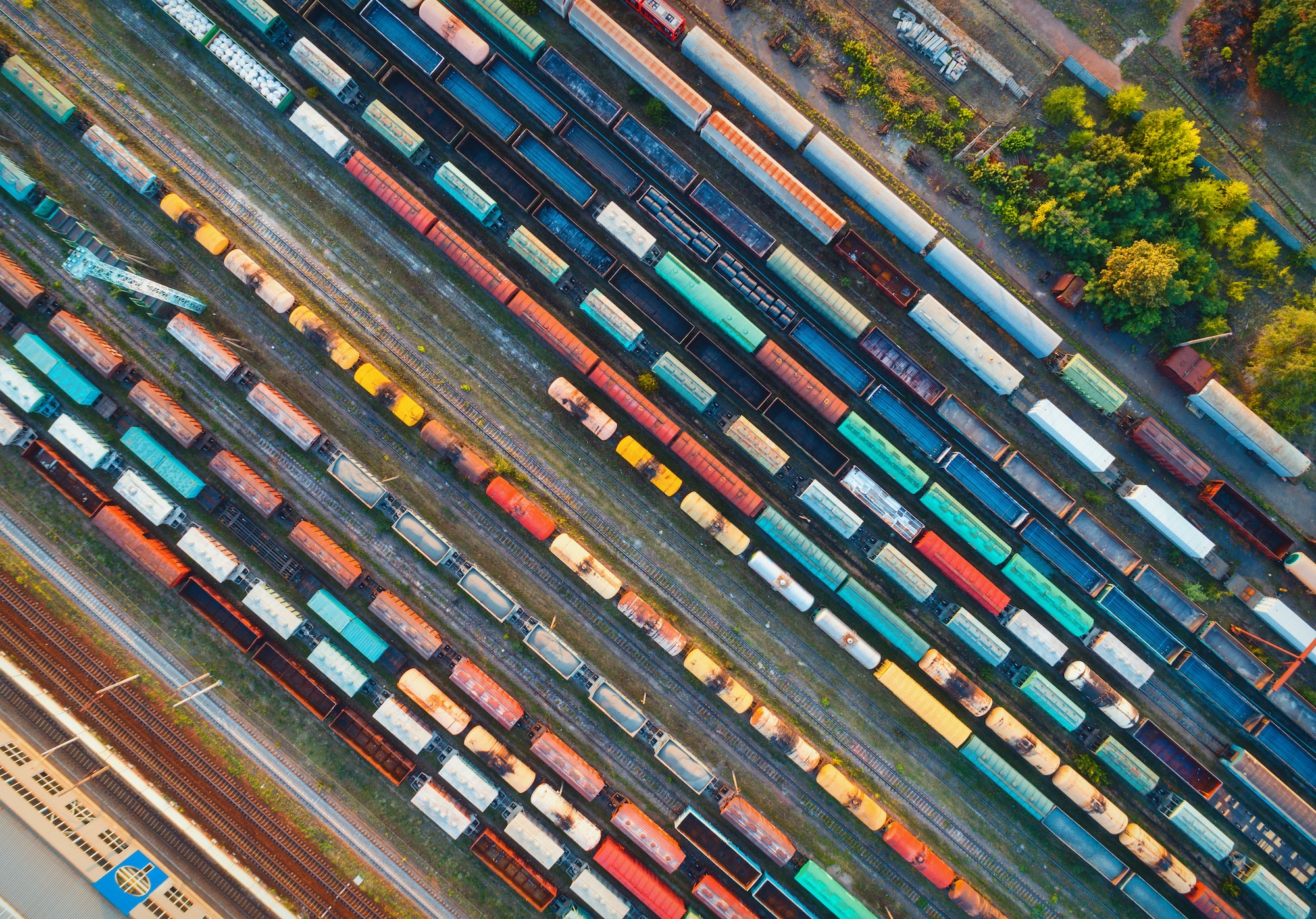 Top view of colorful cargo trains. Aerial view - Haulogis